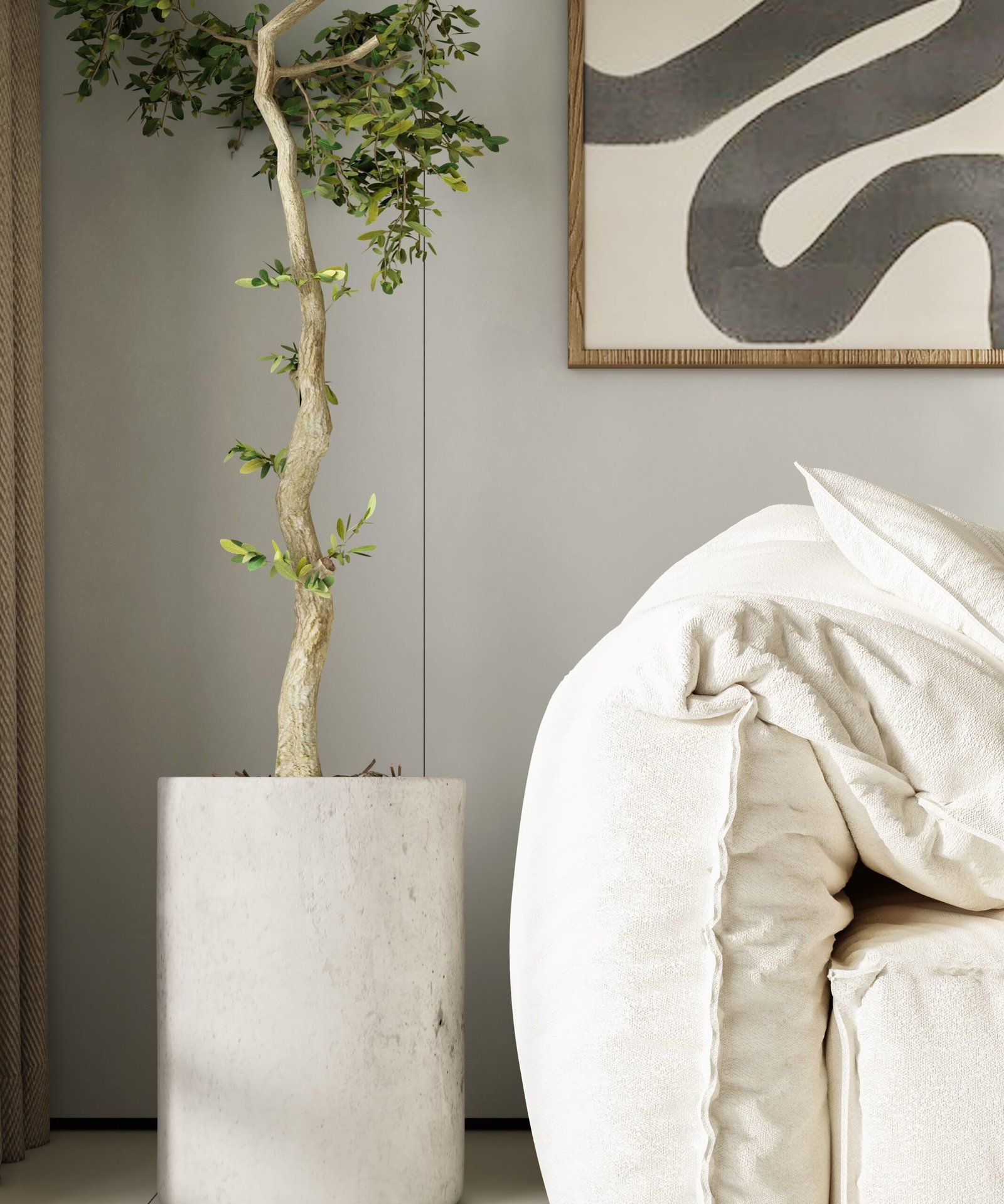 Planta d’interior al costat d’un sofà beix i un quadre de línies orgàniques. Espai lluminós i natural.